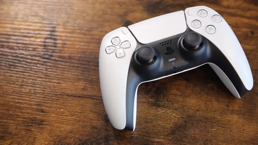 PlayStation 5 DualSense controller on a wooden table for PS5 buying guide in Egypt